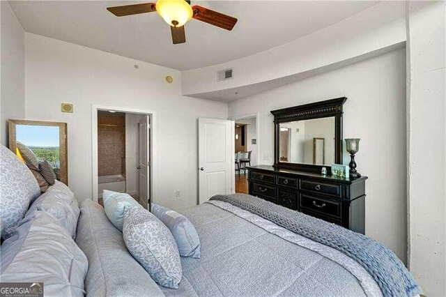 bedroom featuring ceiling fan and ensuite bathroom