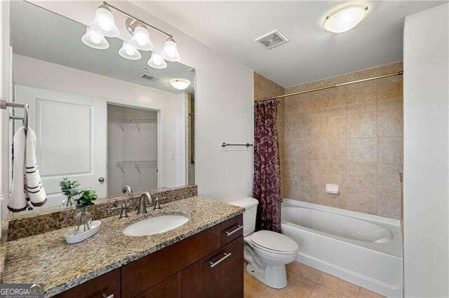 full bathroom with vanity, shower / bath combo, toilet, and tile patterned flooring