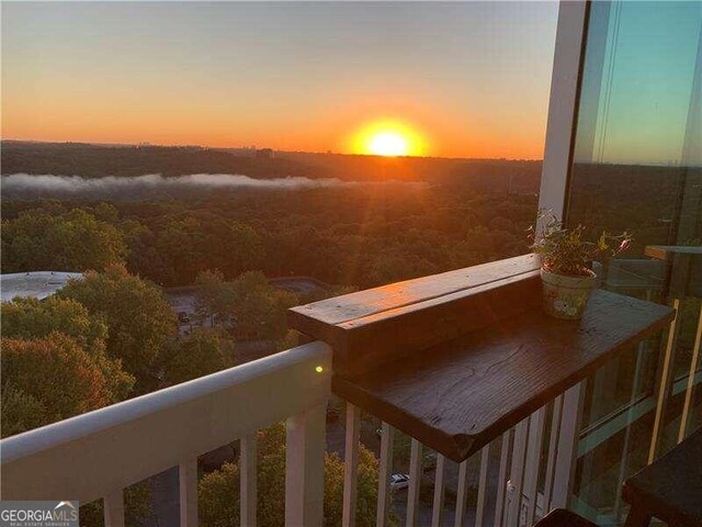 view of balcony at dusk