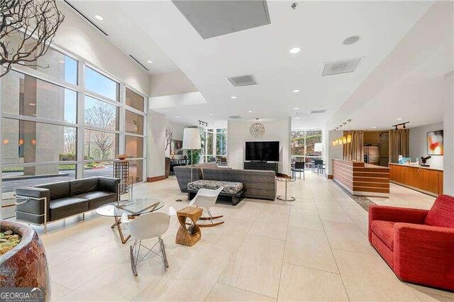 living room featuring light tile patterned flooring