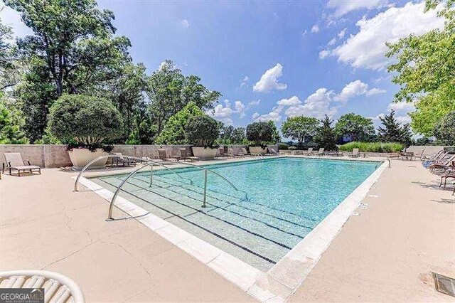 view of swimming pool with a patio