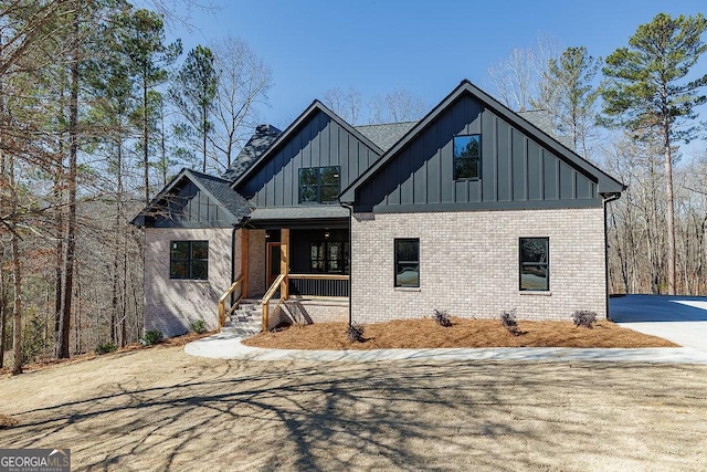 modern farmhouse style home with a porch