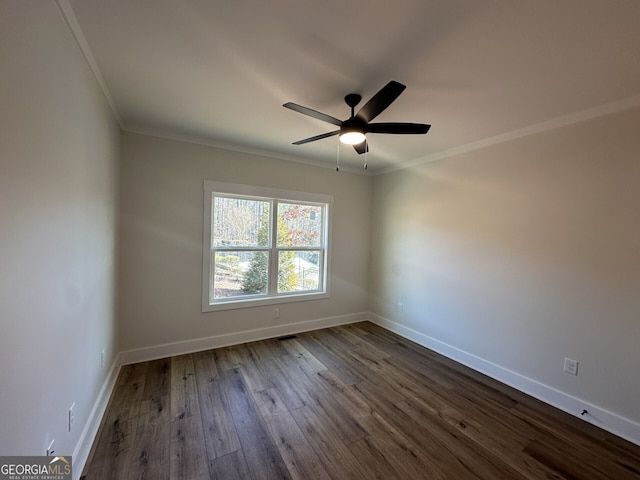 spare room featuring crown molding, ceiling fan, and dark hardwood / wood-style flooring