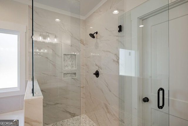 bathroom featuring a shower with shower door