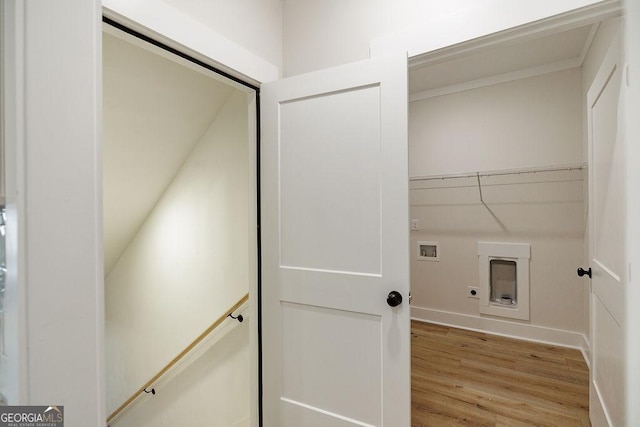 laundry area with hardwood / wood-style flooring, washer hookup, and hookup for an electric dryer