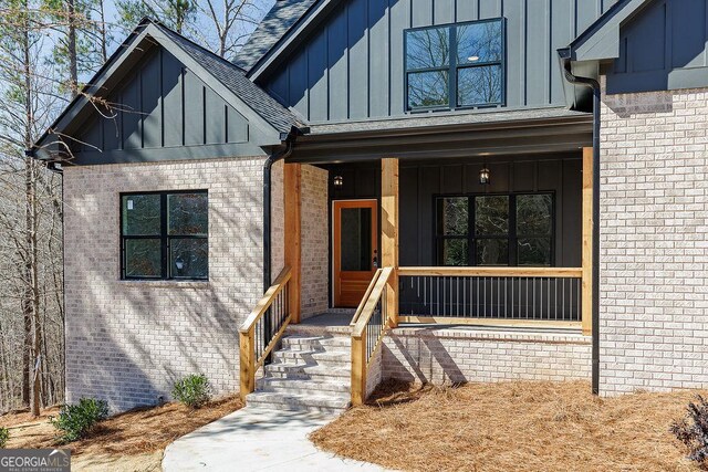 doorway to property featuring a porch