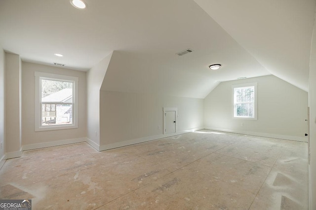 additional living space with vaulted ceiling