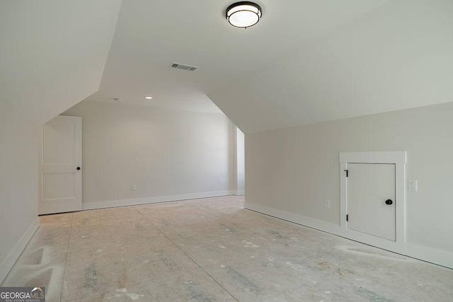 additional living space with vaulted ceiling