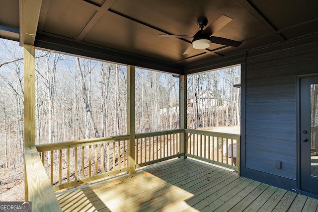 wooden deck featuring ceiling fan