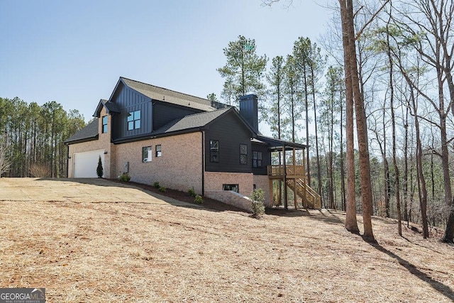 view of side of home with a garage