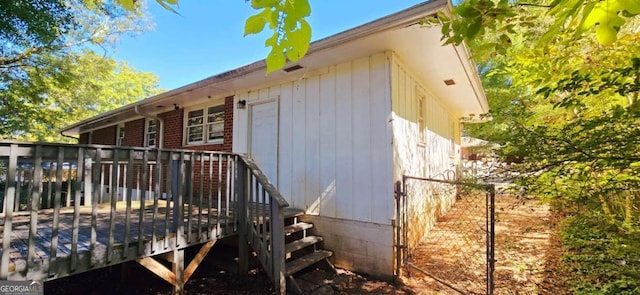 view of home's exterior featuring a wooden deck