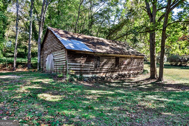 164 Manning Gin Rd, Bethlehem, GA 30620 - view of home's exterior featuring an outdoor structure and a lawn