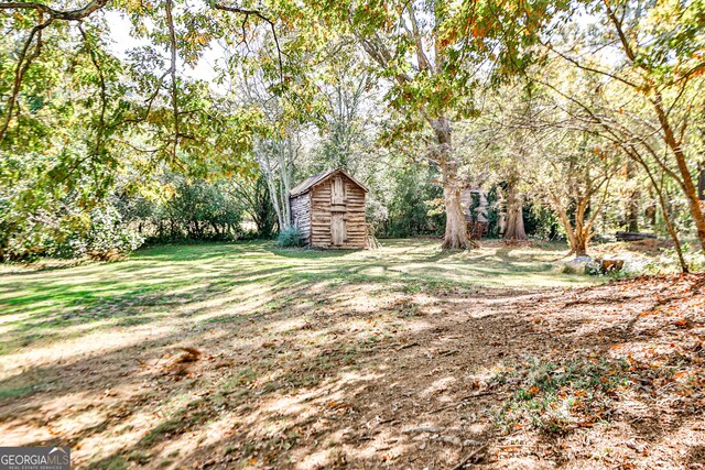 164 Manning Gin Rd, Bethlehem, GA 30620 - view of green lawn with a storage unit