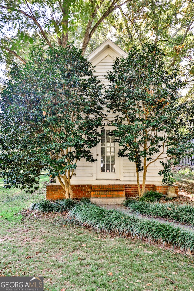 view of home's exterior featuring a yard