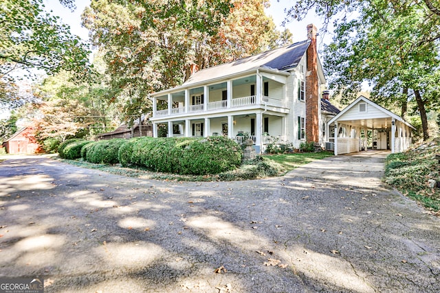 view of front of house featuring a porch and a balcony