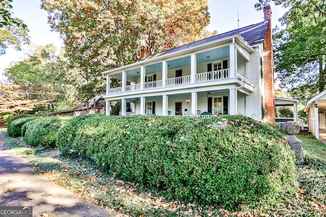 view of front facade featuring a porch and a balcony