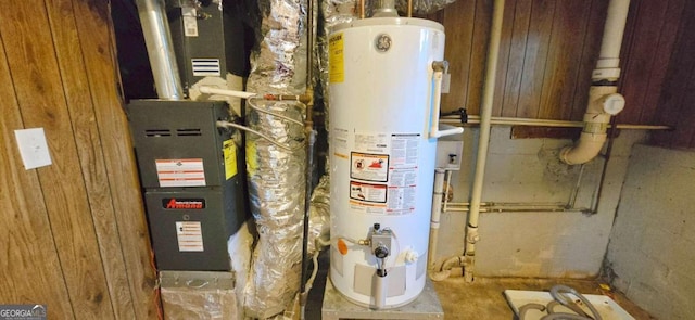 utility room featuring gas water heater