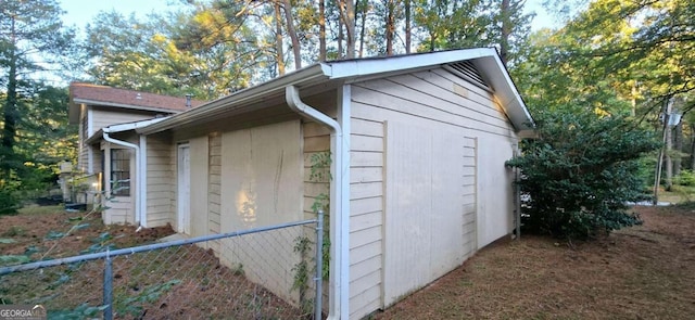 view of outbuilding with fence