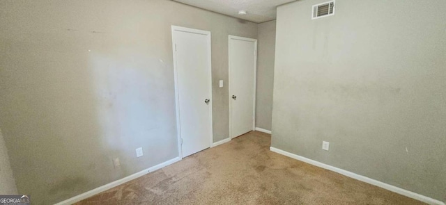 empty room with carpet flooring