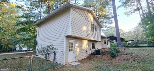 view of side of home featuring cooling unit