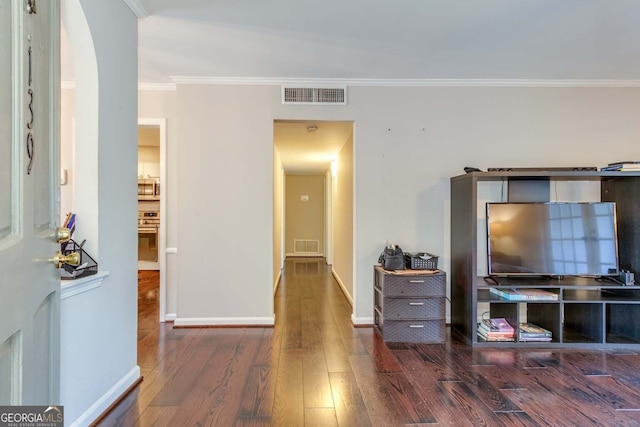 living room with crown molding and dark hardwood / wood-style flooring