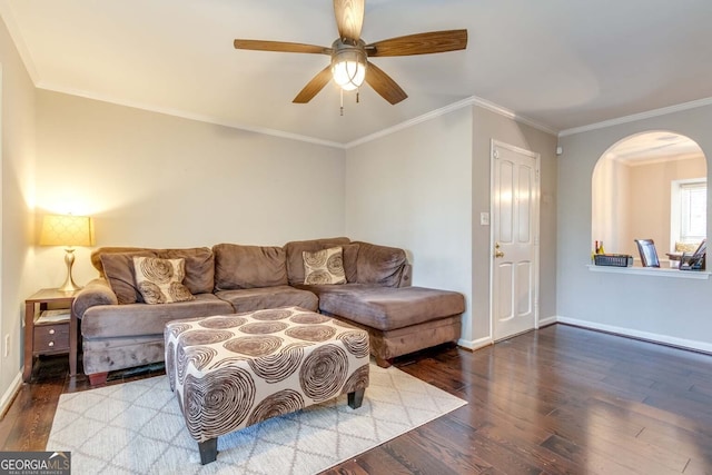 living room featuring ornamental molding, wood-type flooring, and ceiling fan