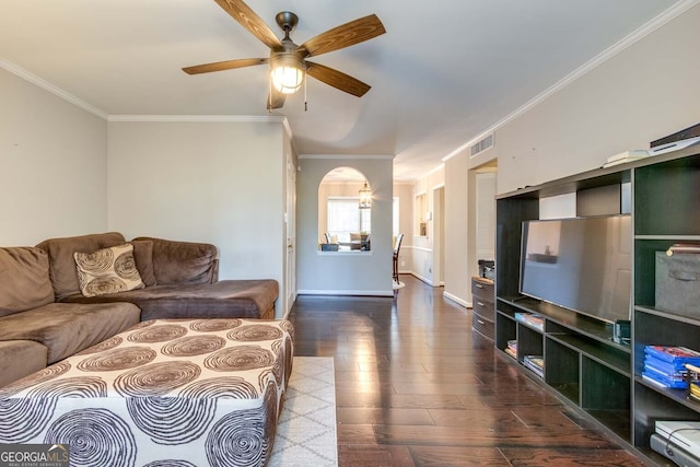 living room featuring ornamental molding, hardwood / wood-style floors, and ceiling fan