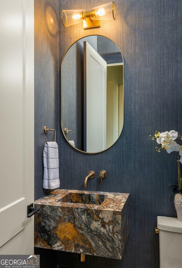 bathroom featuring sink and toilet