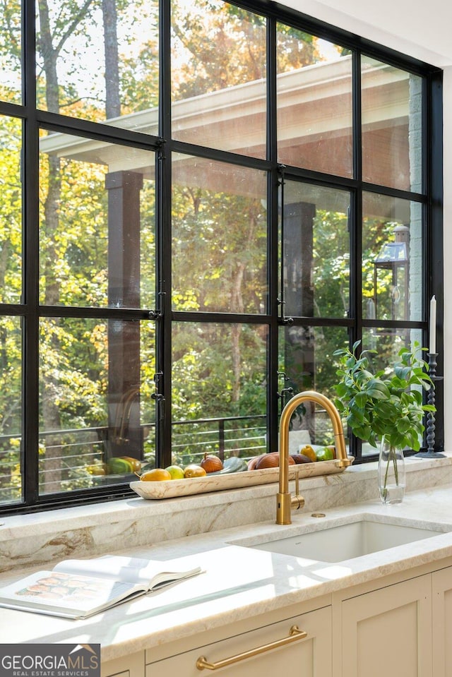 room details with sink and light stone countertops