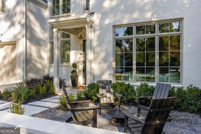 view of patio / terrace featuring an outdoor fire pit