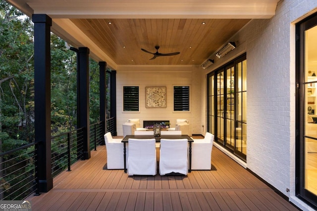 wooden terrace featuring ceiling fan