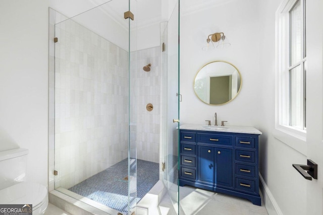 bathroom with tile patterned flooring, vanity, an enclosed shower, and toilet