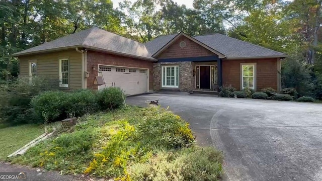 10 Quiet Place Ln, Clayton, GA 30525 - ranch-style home with concrete driveway, a garage, roof with shingles, and stone siding