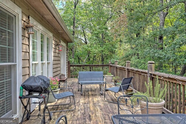 wooden terrace with grilling area