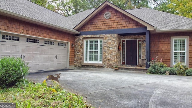 10 Quiet Place Ln, Clayton, GA 30525 - view of front of house featuring roof with shingles, driveway, and a garage
