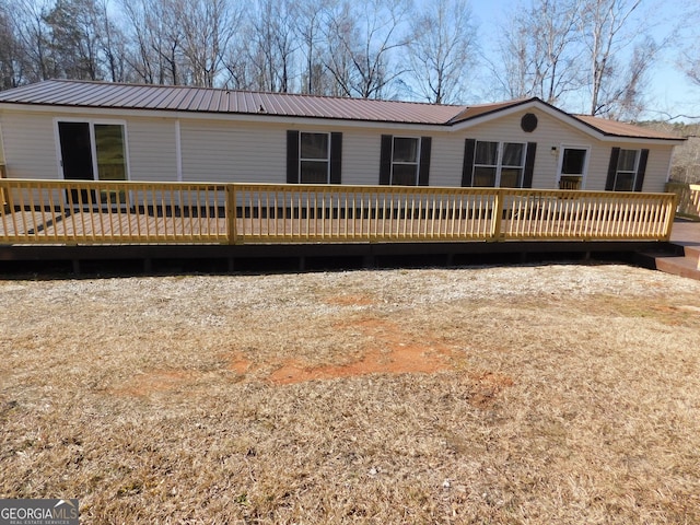 view of front facade with a wooden deck