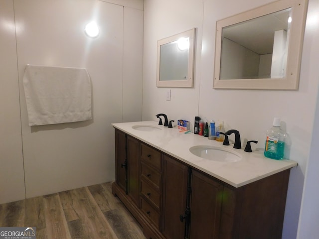 bathroom with wood-type flooring and vanity