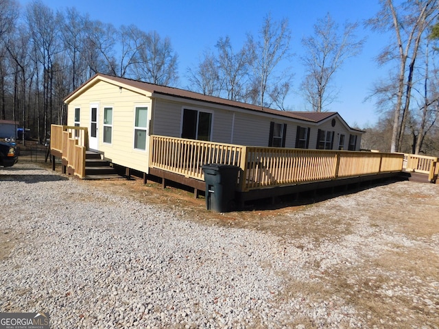 back of property with a deck