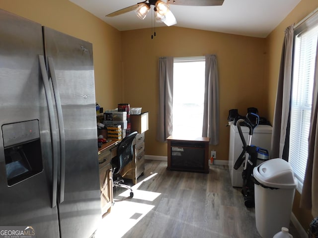 office area with dark hardwood / wood-style flooring, vaulted ceiling, and ceiling fan