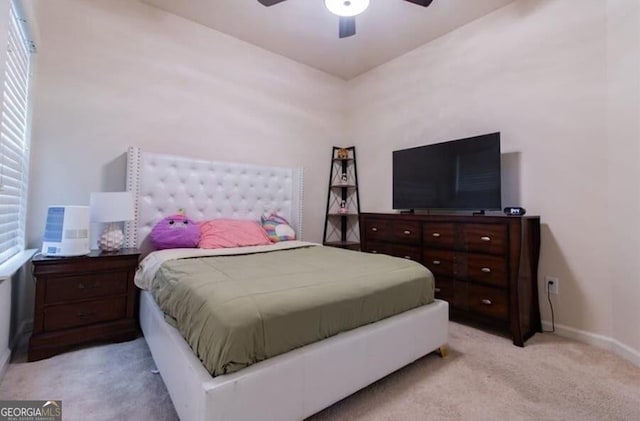 bedroom with light carpet and ceiling fan