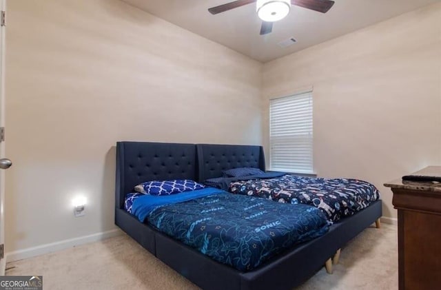 bedroom featuring ceiling fan and light colored carpet