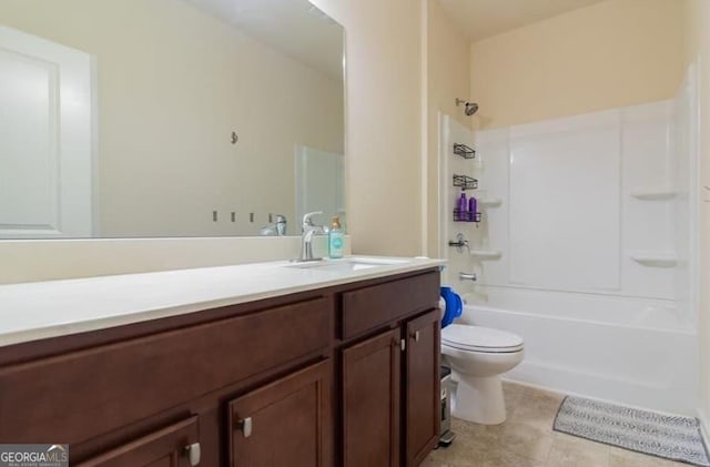 full bathroom featuring toilet, vanity,  shower combination, and tile patterned floors