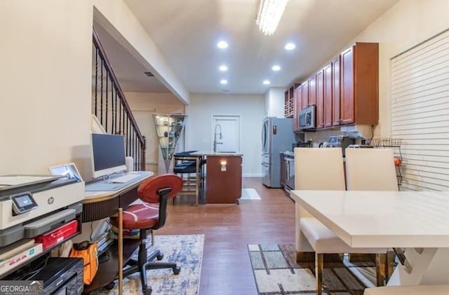 office area with dark hardwood / wood-style floors and sink