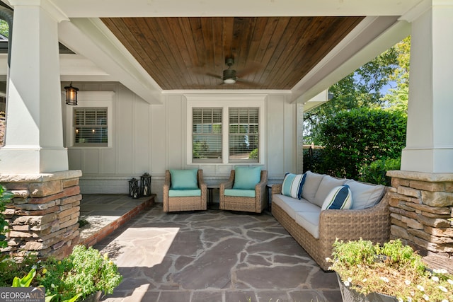 view of patio with ceiling fan and an outdoor living space