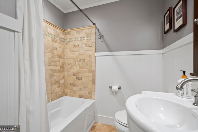 full bathroom with tile patterned floors, shower / tub combo with curtain, toilet, and sink