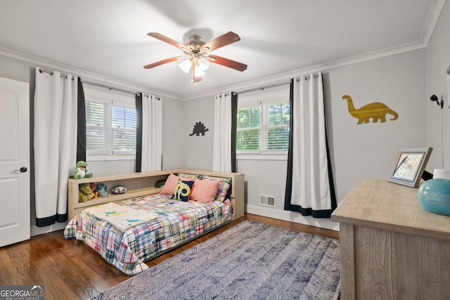 bedroom with ceiling fan, ornamental molding, dark wood-type flooring, and multiple windows