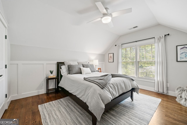 bedroom with lofted ceiling, ceiling fan, and dark wood-type flooring