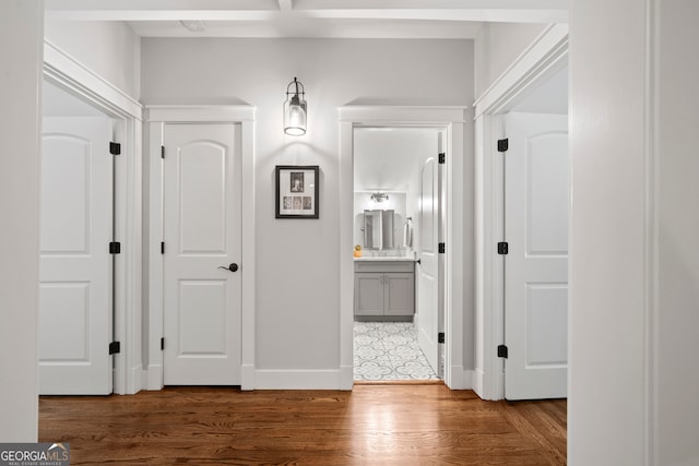 hallway featuring dark hardwood / wood-style flooring