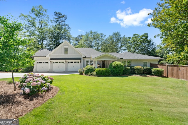 view of front facade with a front lawn and a garage