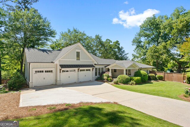 view of front facade featuring a front lawn and a garage